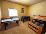 Lower level bedroom 5 with bunks and games
